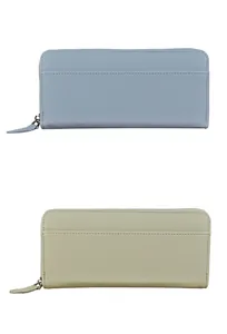 Detail of light blue and sage green accordion wallets with litchi grain texture
