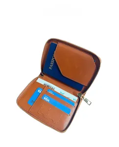 Internal capacity display of brown leather travel wallet with passport slot and card holders