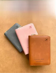 Three multi-color RFID travel wallets with gold zippers and embossed airplane icons