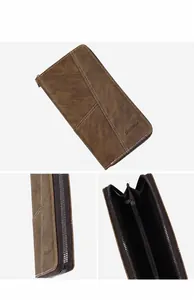 Détails du portefeuille en cuir marron avec fermeture éclair et compartiments cartes