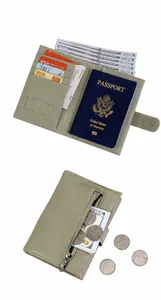 Detail of light green leather passport holder with multiple card slots and passport pockets