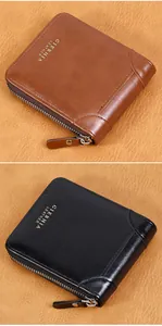 Detail of vintage leather wallets in brown and black with wrap-around metal zipper closure