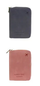 Detail view of RFID passport wallet with zipper closure and embossed classic star logo