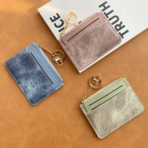 Mini slim leather card holders with zipper and keychain in blue, pink, and green