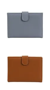 Detail of grey and brown lychee textured passport wallets with fine stitching