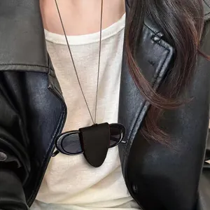 Chic black leather magnetic sunglasses holder necklace with a minimalist lanyard