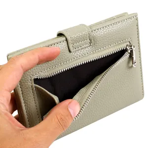 Compact light green pebble leather travel passport wallet and card holder with silver zipper