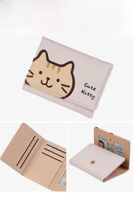 Detail view of pink trifold wallet featuring multiple card slots and cute cat print