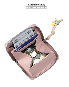 Pink wallet interior showcasing capacity for coins, cash, and blue card slots