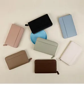 Flat lay of large capacity zip wallets in seven colors with premium pebble leather texture