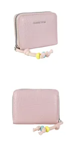 Detail of pink leather coin purse with classic star print and colorful beaded zipper pull