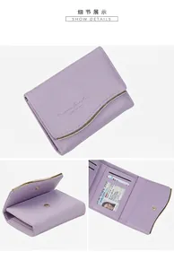 Macro detail of lavender tri-fold wallet showing card slots and transparent ID window