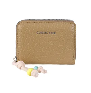 Detail of camel leather wallet with lychee texture and colorful beaded zipper puller