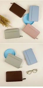 Litchi texture leather travel wallets in deep brown, light blue, green, and pink colors