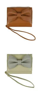Close-up of stylish PU leather bow wallets in caramel brown and sage green with wrist straps
