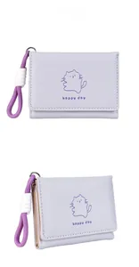 Detail of lavender tri-fold wallet with cat print, leather texture and braided lanyard