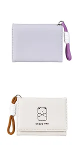 Detail of PU leather wallet showing cute bear print and braided lanyard with metal ring
