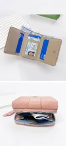 Pink pebbled leather wallet featuring multiple card slots and a large zipper coin pocket