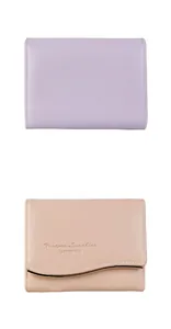 Close-up of leather texture with golden wave hardware on the short bifold wallets