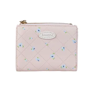 Petit portefeuille rose pour femme avec motif floral, matelassage et fermeture éclair dorée
