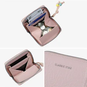 Pink pebbled leather short wallet with colorful beads and internal storage compartments