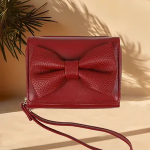 Elegant wine red bow-knot wallet for women featuring a minimalist PU leather design