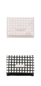 Detail of pink and black plaid tri-fold wallets with cute bow patterns and cute girl labels