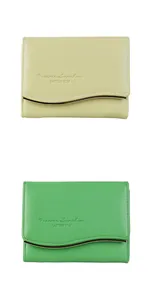 Detail of wave-cut leather wallets with gold metal trim and embossed text