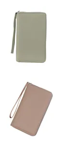 Detail of lychee pattern leather texture on long zipper passport wallets with wrist straps