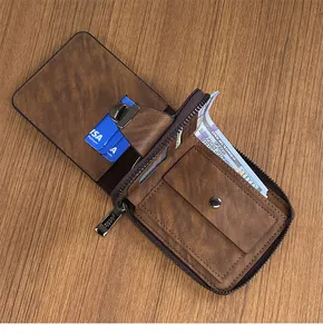 Detailed macro view of brown vintage leather wallet with multiple card slots and zipper