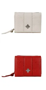 Detail of red and cream embossed leather wallets with floral texture and metal flower charms