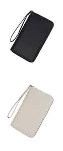 Vertical view of black and beige litchi leather passport wallets with wrist straps