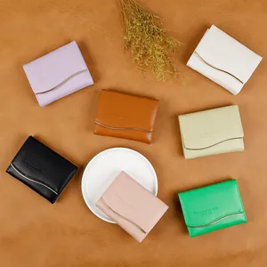Short elegant women wallets with curved metal hardware in six various stylish colors