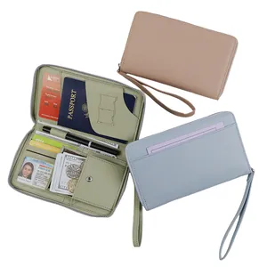 Minimalist large capacity passport wallet in lychee grain with wristlet strap