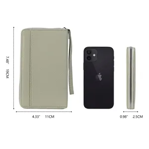 Minimalist grey-green pebbled leather passport wallet with dimensions 19x11x2.5 cm