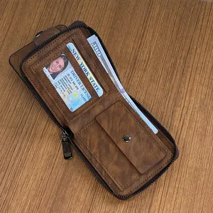 Men's vintage brown leather wallet with zipper around closure and multi-card slots