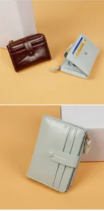 Detail of vintage cracked leather bifold wallet with gold zipper and snap closure