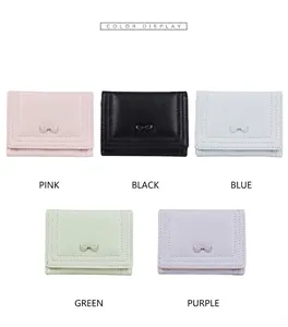 Short tri-fold wallets in pastel colors featuring a sweet bow and leather texture