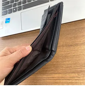 Close-up of black bifold wallet showing brown lining and multiple card slots
