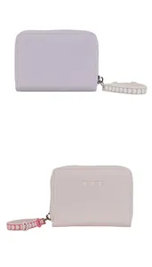 Detail of compact zipper purses in lavender and pink with cute cat embroidery and wrist strap