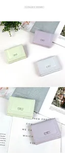 Detailed view of trifold pastel purses with cute bow knots in lavender, mint, and blue