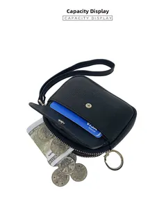 Capacity display of the black pebbled leather coin purse with wristlet and key ring