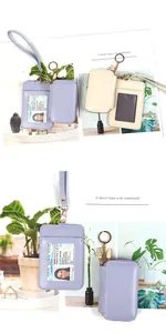 Detail view of leather ID holder with zipper coin pouch and wristlet strap in pastel colors