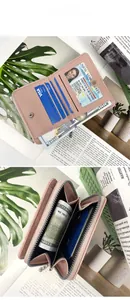 Internal structure of a pink leather wallet featuring multi-card slots and coin pocket