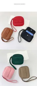 Macro view of multi-color litchi grain leather wallets with wristlets and card slots