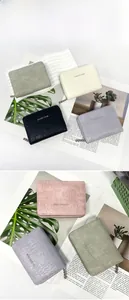 Detailed flat lay of PU leather wallets with classic star logo in five pastel colors