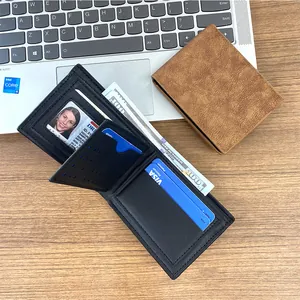 Vintage men's short bifold leather wallet with multiple card slots on an office desk