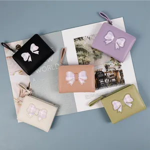 Short PU leather bow wallets for women with wrist straps in five assorted colors