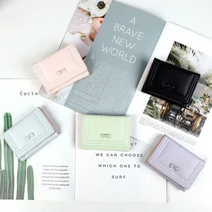 Short trifold bow wallet for women in five pastel macaron colors with PU leather finish