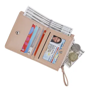 Pink PU leather bifold wallet for women with bow detail, card slots and zipper pocket